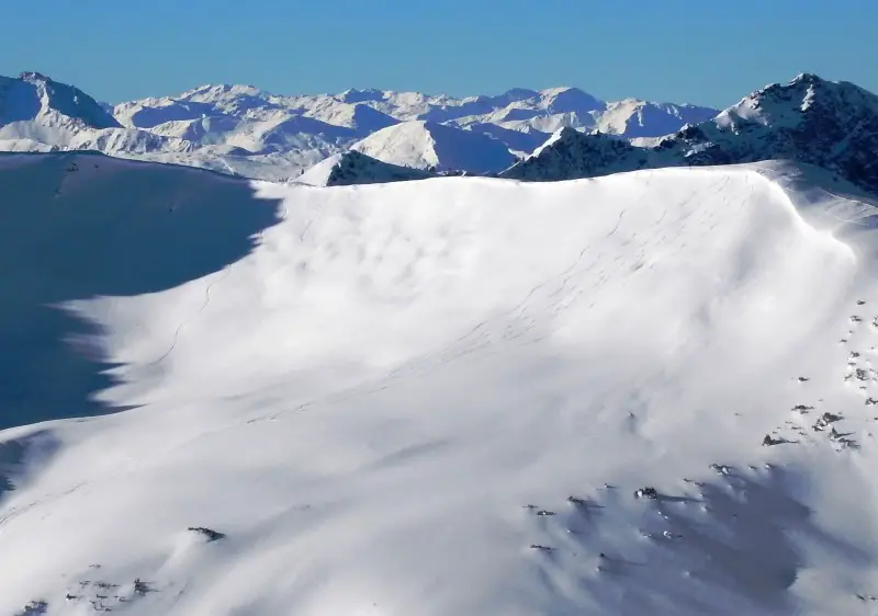 Upper mountain powder skiing above Saalbach